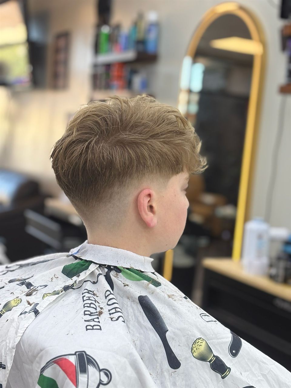 Kids' haircut in progress at a Broadmead barbershop in Saanich